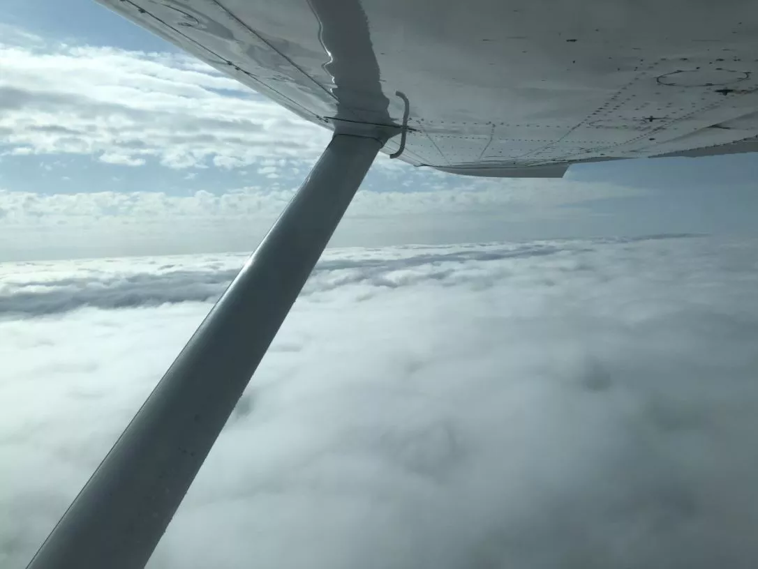 Wings of a plane in the clouds