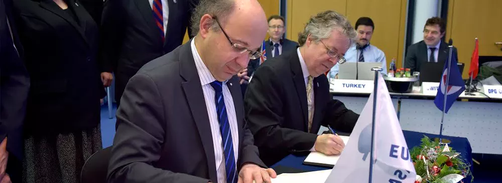 image of dr. volz signing a document