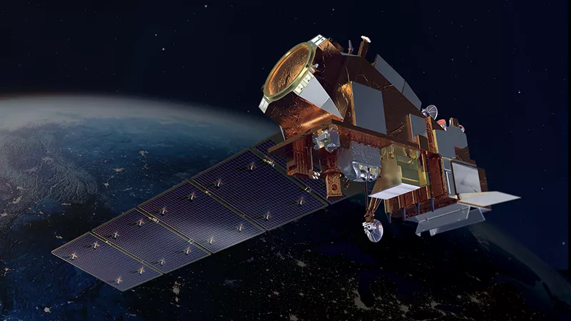 Closeup of a satellite in space hovering over Earth