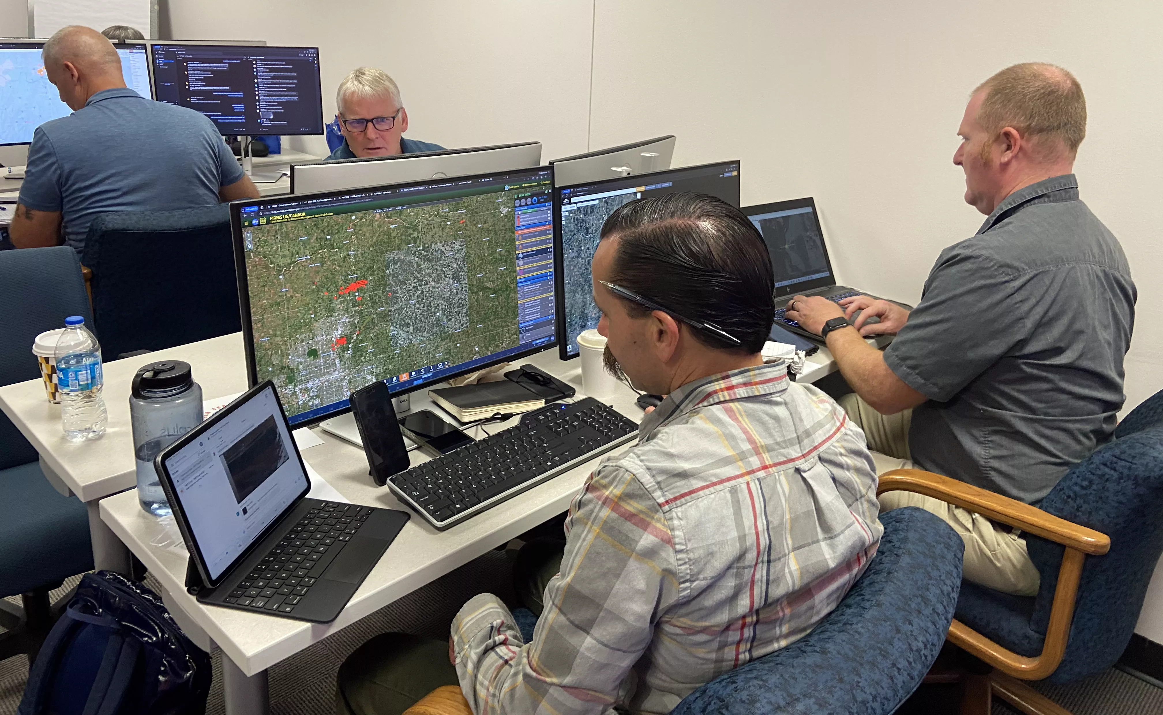 Members of Cal Fire and the NWS work in a computer lab during a testbed evaluation to form a simulated Integrated Warning Team to detect new fires, respond to them, and collaborate on issuing Fire Warnings. 