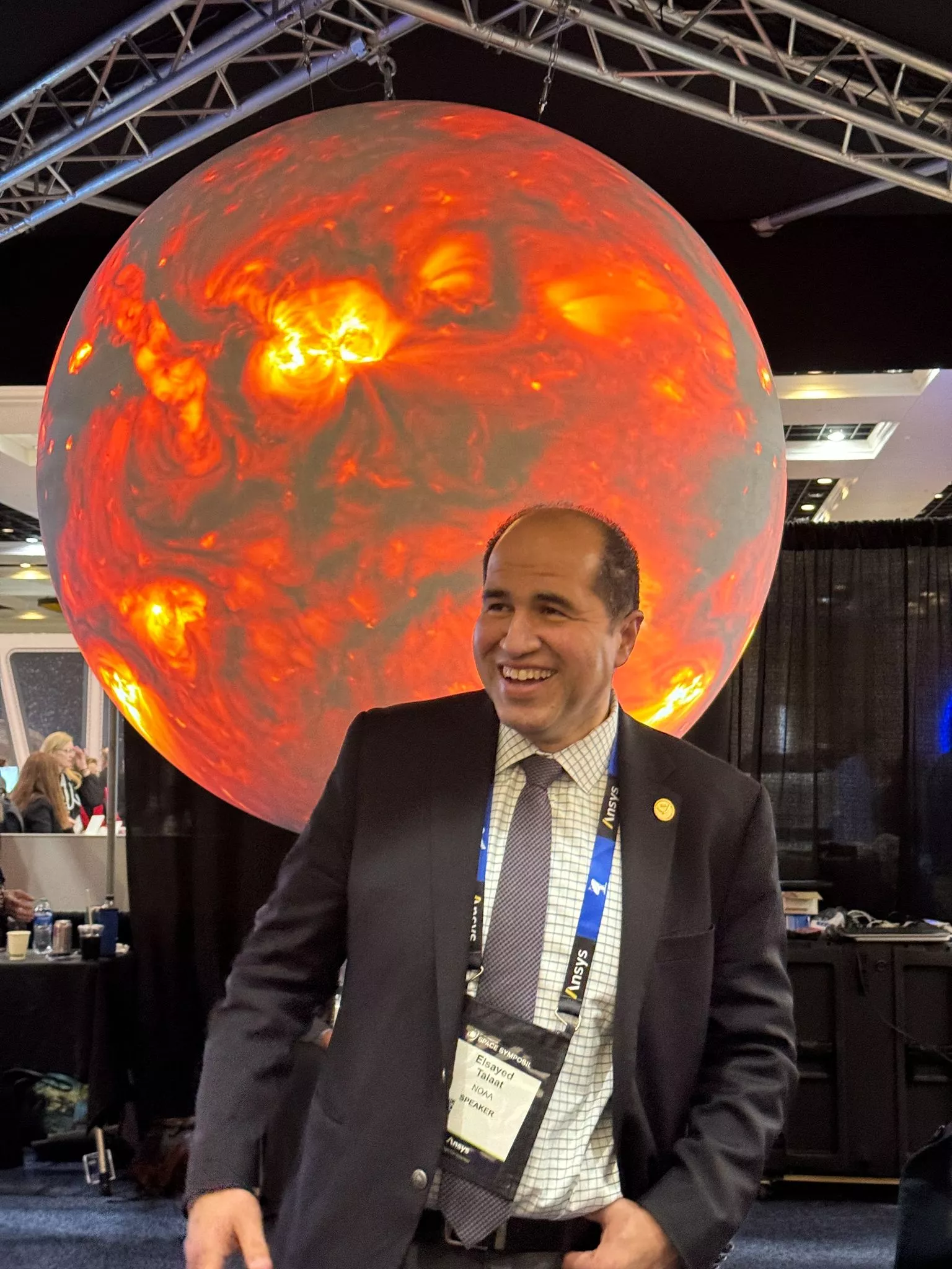 Elsayed Talaat in front of a orange sun 