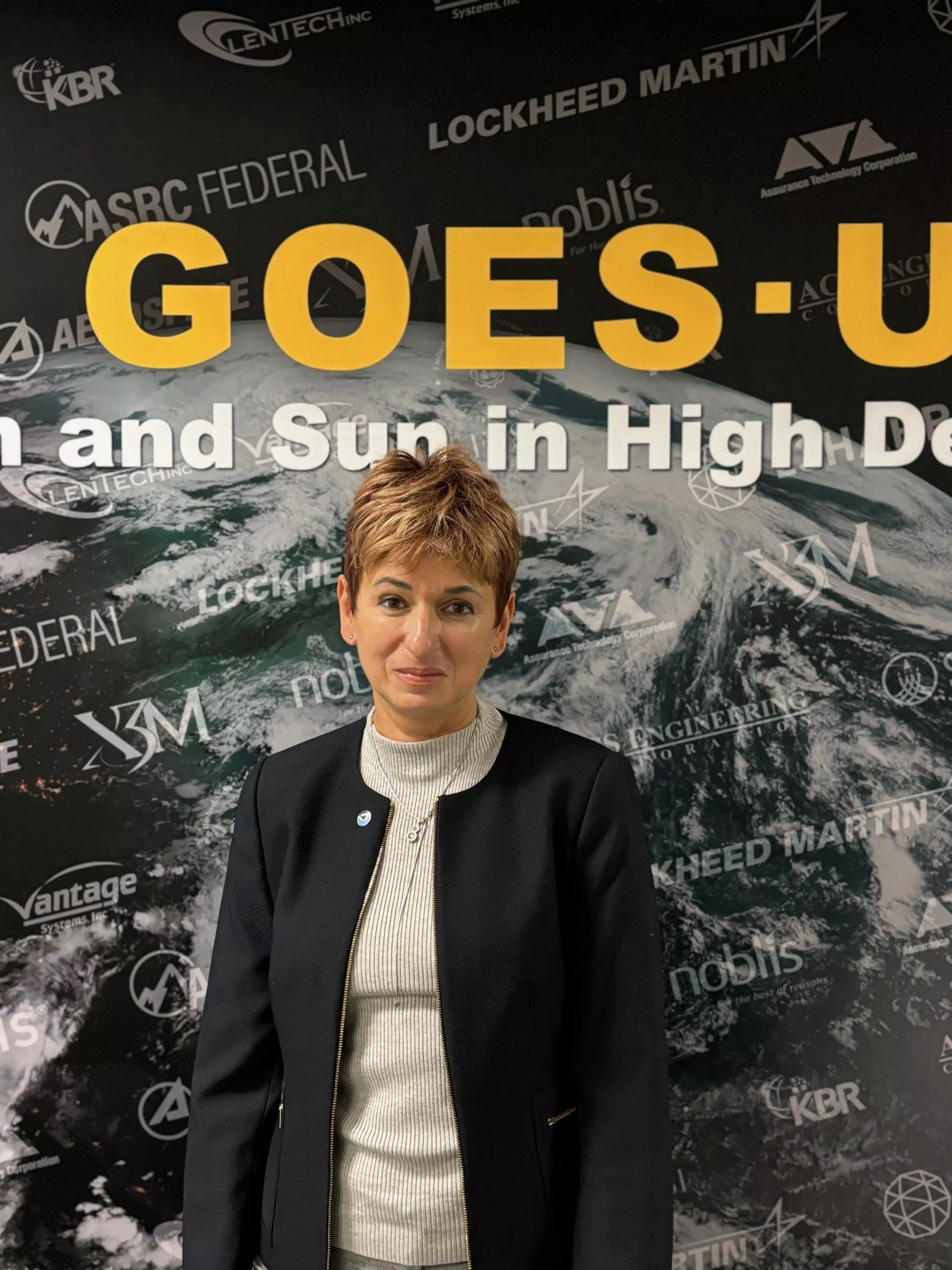 Monica Todirita in front of a GOES-U Image