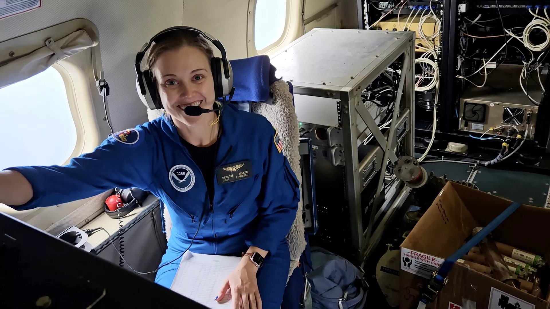 Rebecca Keller In and Airplane with a computer.