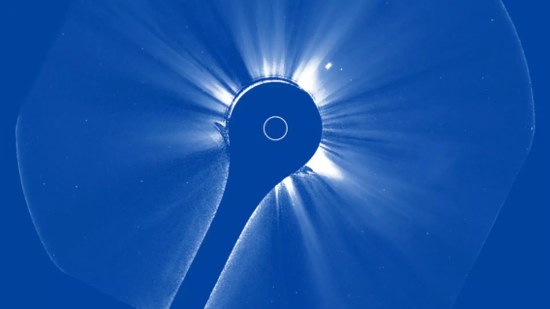 Image of the sun from space that has a blue hue.