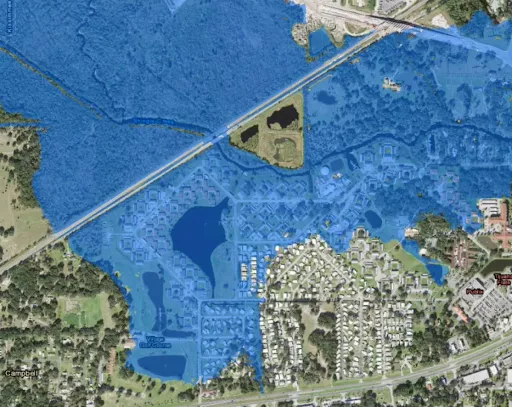 Campbell, Florida seen from space with blue shading around the flooding areas.
