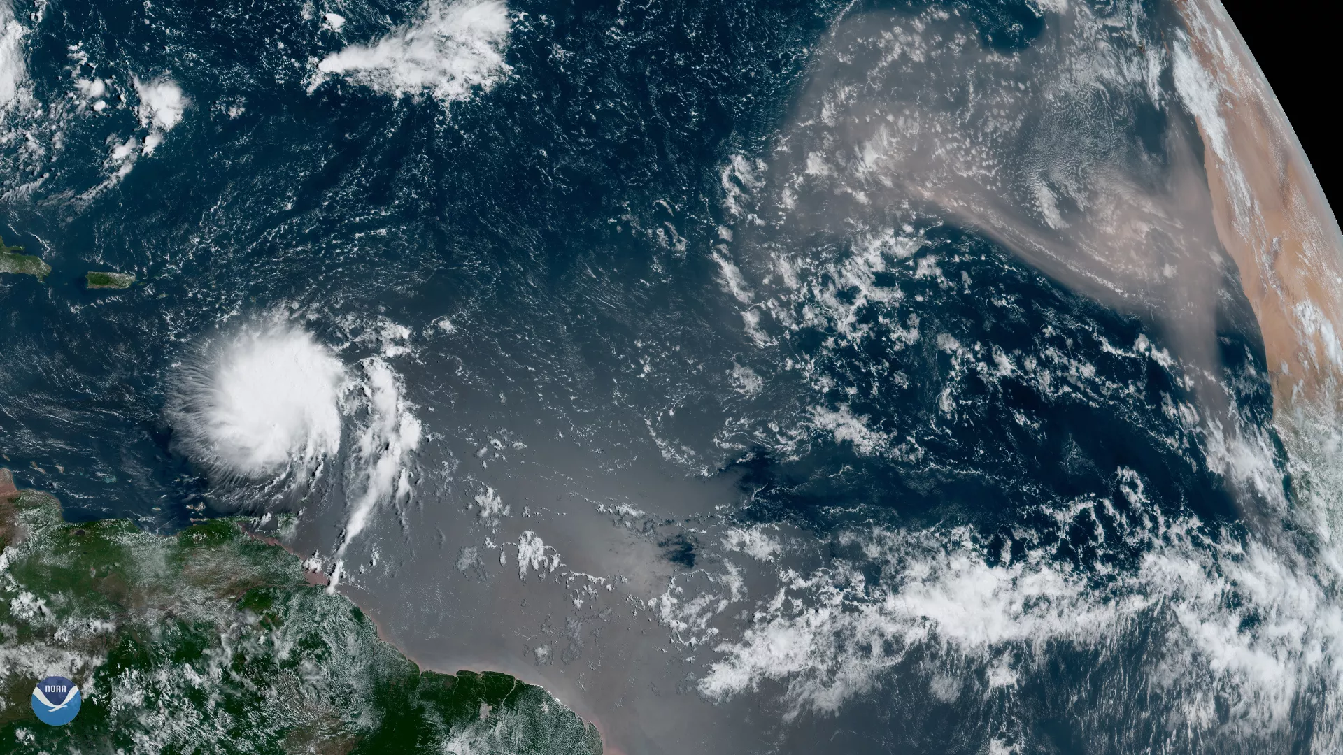 GOES East GeoColor capture of the largest plumes of Saharan dust this year blowing across the Atlantic Ocean on Tuesday, Aug. 27, 2019, as Tropical Storm Dorian passed over the Lesser Antilles.