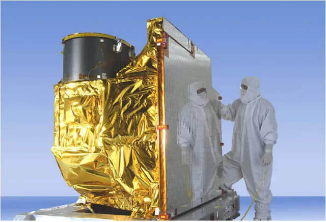 The ABI instrument with a scientist beside it.
